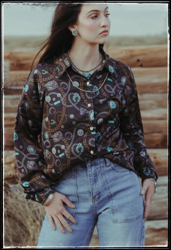 Cowboy deluxe pattern on a long sleeve button u shirt in satin. 