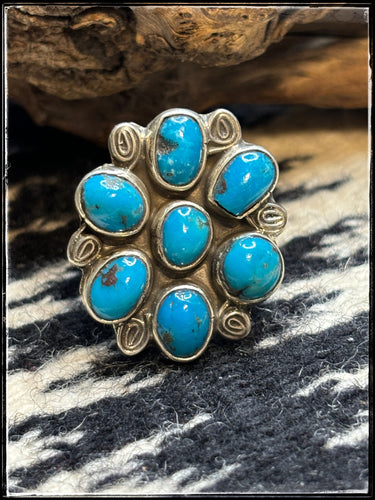 Priscilla Reeder Navajo silversmith.  Sterling silver and 7 turquoise stone cluster ring.  