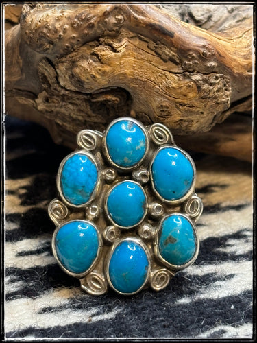 Priscilla Reeder Navajo silversmith.  Sterling silver and 7 turquoise stone cluster ring.  