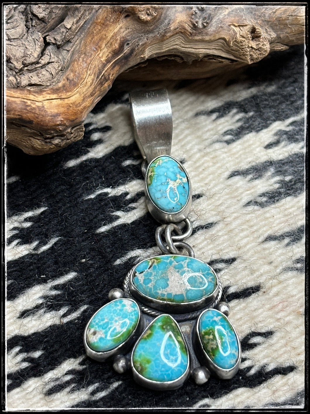 Betty Tom, Navajo silversmith. Sonoran Gold pendants in light blue and deep green.  light blue