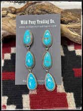 Load image into Gallery viewer, Trisha Largo, Navajo silversmith.  Sterling silver and Kingman turquoise triple teardrop earrings. 
