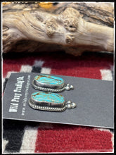 Load image into Gallery viewer, Judith Dixon, Navajo silversmith.  Sterling silver and Kingman turquoise, post style oblong studs. 
