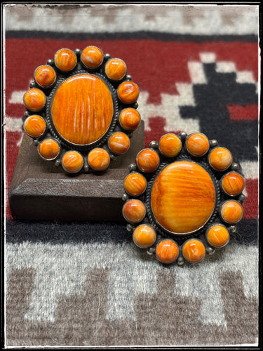 Dean Brown, Navajo silversmith. Orange spiny oyster shell cluster rings with adjustable bands.