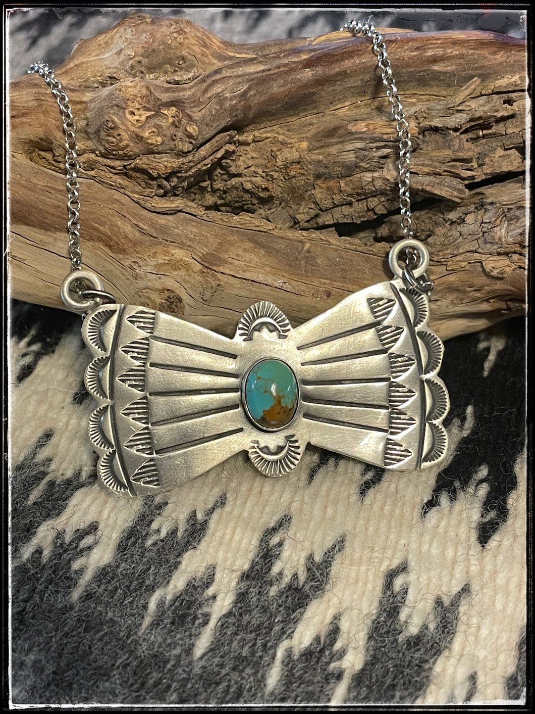 Rick Enriquez, sterling silver and kingman turquoise bowtie necklace on a 16