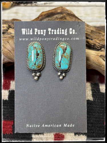 Judith Dixon, Navajo silversmith.  Sterling silver and Kingman turquoise, post style oblong studs. 