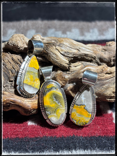 Samson Ettsity, Navajo silversmith.  Sterling silver and bumble bee jasper pendants 