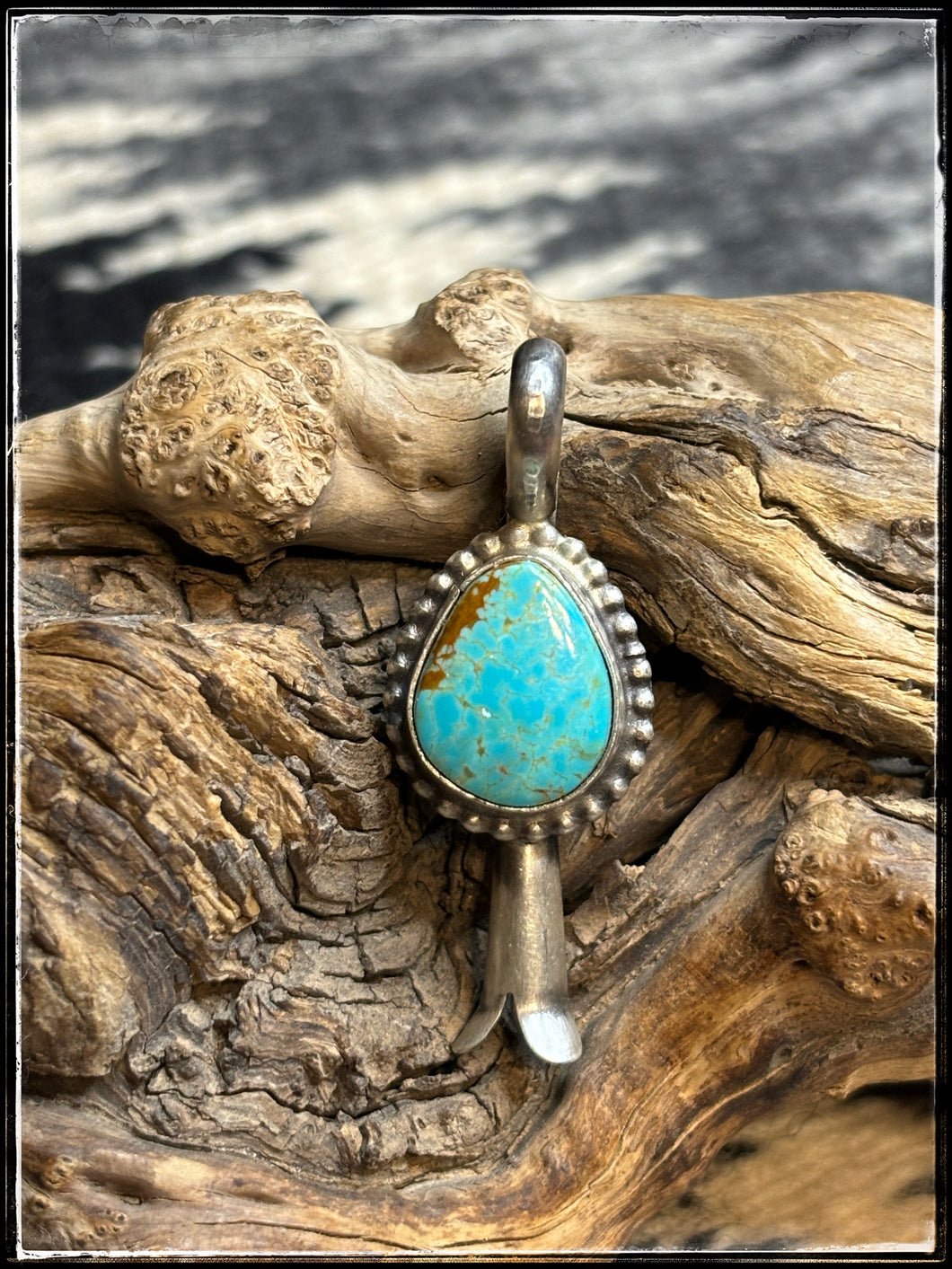 Freda Martinez, Navajo silversmith - turquoise and sterling silver mini squash blossom pendant. 