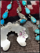 Load image into Gallery viewer, Anyssa Martinez, Navajo silversmith.  Sterling silver and Kingman turquoise Naja necklace. AM hallmark stamp. 
