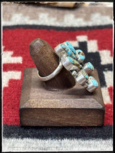 Load image into Gallery viewer, Donovan Skeets, Navajo silversmith. Sterling silver and Kingman turquoise Naja ring with an adjustable band. 
