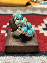 Load image into Gallery viewer, Augustine Largo, Navajo silversmith. Sterling silver and kingman turquoise cluster with an adjustable band.

