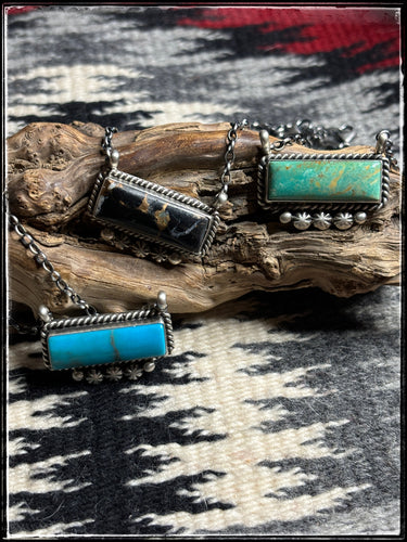Navajo made, medium bar necklaces with starshots across the bottom.  
