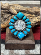 Load image into Gallery viewer, Annie Spencer, Navajo silversmith.  Sterling silver, Kingman turquoise, and a mercury dime cluster ring with an adjustable band. 
