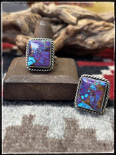 Load image into Gallery viewer, Donovan Skeets, Navajo silversmith.  Sterling silver and purple mojave composite stones with an adjustable ring band. 
