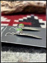 Load image into Gallery viewer, Sterling silver and Sonoran Gold turquoise feather earrings attributed to Ervin Hoskie. These are hallmarked and Navajo made. 
