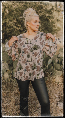 Sheer top with an inner black shell.  Soft and blousy from 2Fly clothing brand. Cactus, conchos, and cow print  