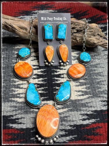 Larose Ganadonegro, Navajo silversmith.  Orange Spiny shell and turquoise multi stone necklace with matching earrings.   