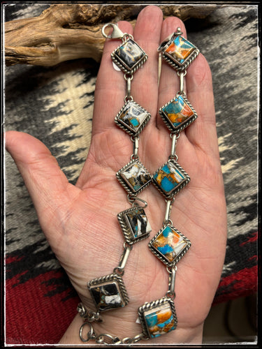 Augustine Largo, Navajo silversmith.  Kingman Krush and Kingman Orange Krush square link bracelets.  