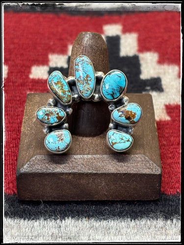 Donovan Skeets, Navajo silversmith. Sterling silver and Kingman turquoise Naja ring with an adjustable band. 