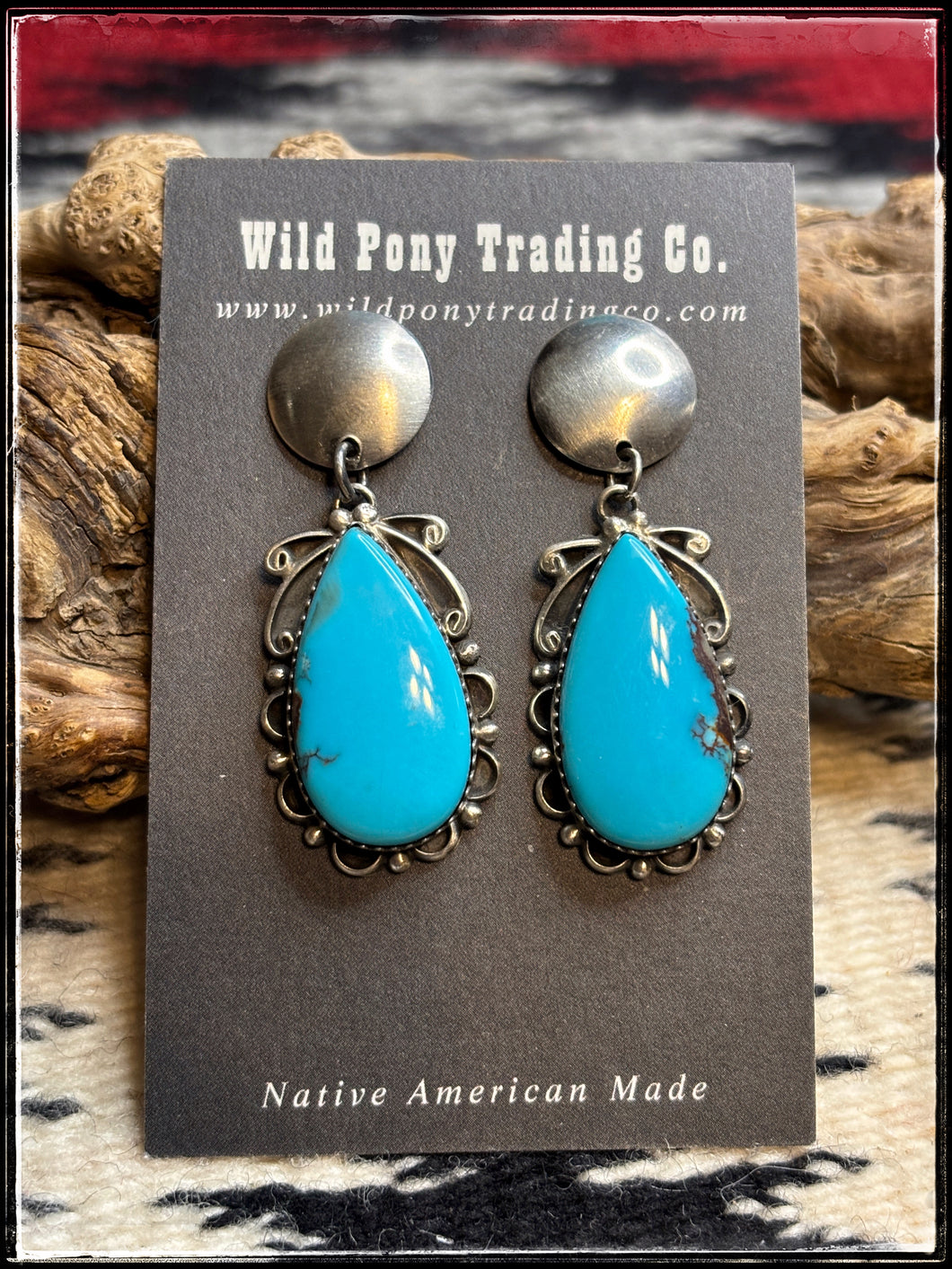 Freda Wilson, Navajo silversmith.  Turquoise drop earrings with silver disc stud posts    Earring A