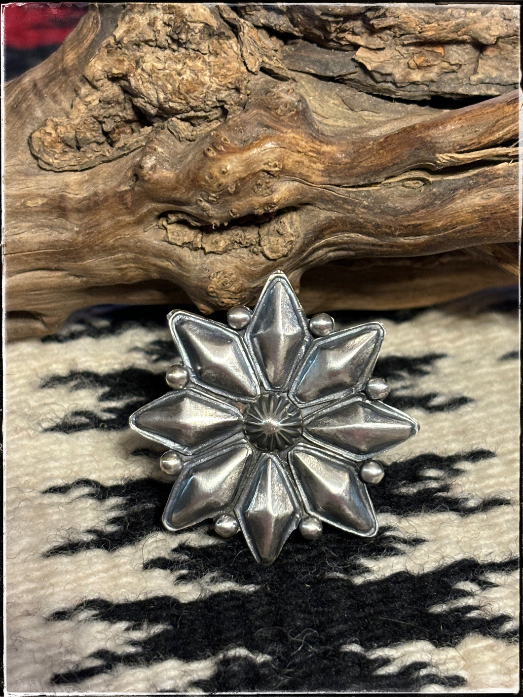 Jaunita Long, Navajo silversmith. Sterling silver starbust ring with an adjustable band.