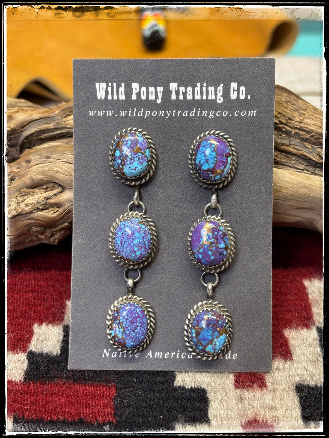 Purple Mojave (composite stone), triple stone earrings from Navajo silversmith Freda Martinez. 