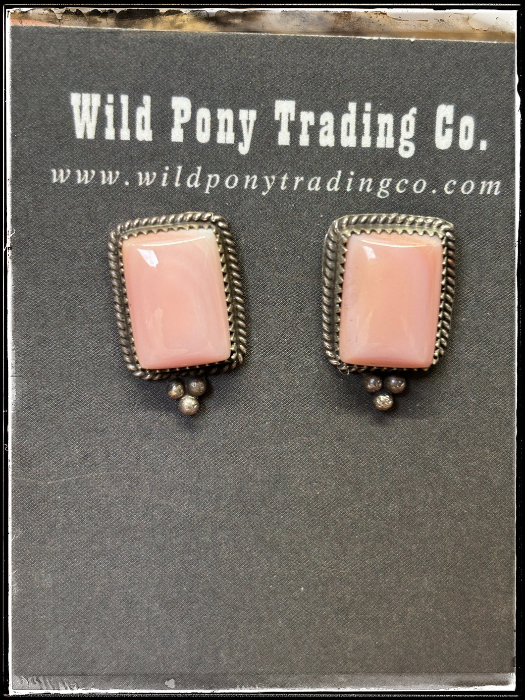 Pair A  Theresa Smith, Navajo silversmith.  Sterling silver and pink conch shell mini stud earrings. 