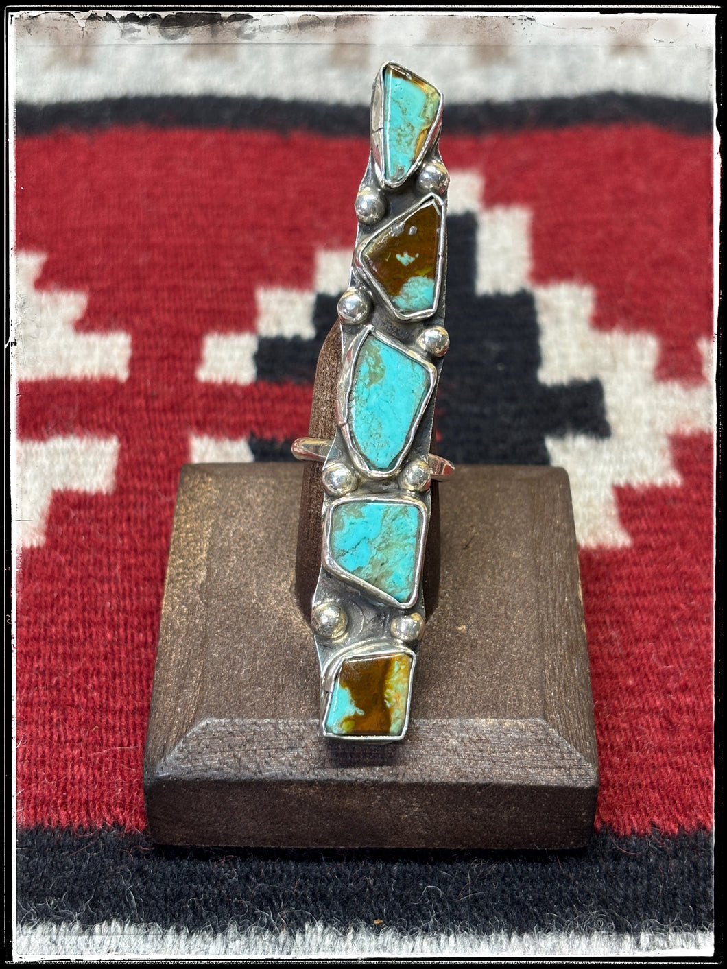 Jude Candelaria, Zuni silversmith.  Five stone, Kingman turquoise and sterling silver bar ring. 