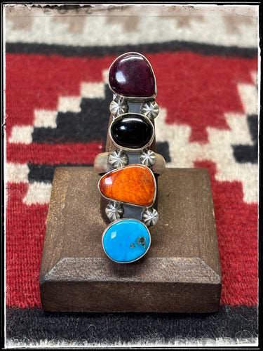 Alfred Martinez, Navajo silversmith. Four stone, multi stone ring featuring purple spiny, orange spiny, turquoise, and black onyx.