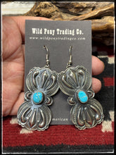 Load image into Gallery viewer, Roland Dixson, Navajo silversmith.  Sterling silver with heavy repousse work and turquoise center stones. 
