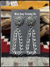 Load image into Gallery viewer, Eugene Charlie, Navajo silversmith.  Sterling silver concho and starshot earrings. 
