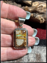 Load image into Gallery viewer, Sampson Ettsity, Navajo silversmith.  Sterling silver and ribbon turquoise, pette pendant. 
