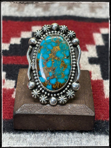 Nancy Woody, Navajo silversmith.  Sterling silver and turquoise ring with an adjustable band. 