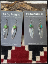 Load image into Gallery viewer, Sterling silver and Sonoran Gold turquoise feather earrings attributed to Ervin Hoskie. These are hallmarked and Navajo made. 
