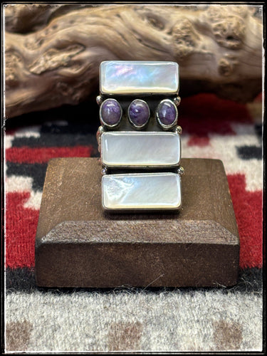 Mary Jane Garcia, Navajo silversmith.  Mother of Pearl, charoite and sterling silver ring with an adjustable band. 