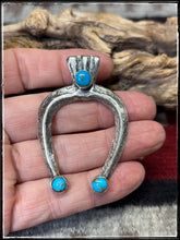Load image into Gallery viewer, Del Areviso, Navajo silversmith.  Sterling silver and sleeping beauty turquoise on tufa cast Naja pendants with shepherd's hooks.
