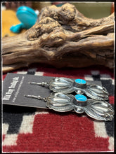 Load image into Gallery viewer, Roland Dixson, Navajo silversmith.  Sterling silver with heavy repousse work and turquoise center stones. 
