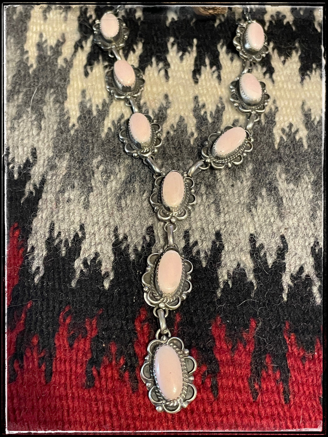 Freda Martinez, pink conch, petite Y necklace. 