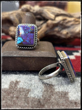 Load image into Gallery viewer, Donovan Skeets, Navajo silversmith.  Sterling silver and purple mojave composite stones with an adjustable ring band. 
