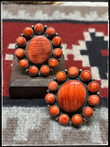 Dean Brown, Navajo silversmith. Red spiny oyster shell cluster rings with adjustable bands.