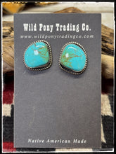 Load image into Gallery viewer, Judith Dixon, Navajo silversmith.  Sterling silver and Kingman turquoise stud earrings. 
