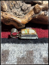 Load image into Gallery viewer, Sampson Ettsity, Navajo silversmith.  Sterling silver and ribbon turquoise, pette pendant. 
