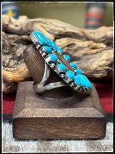 Load image into Gallery viewer, Annie Spencer, Navajo silversmith.  Sterling silver, Kingman turquoise, and a mercury dime cluster ring with an adjustable band. 
