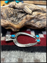 Load image into Gallery viewer, Del Areviso, Navajo silversmith.  Sterling silver and sleeping beauty turquoise on tufa cast Naja pendants with shepherd's hooks.
