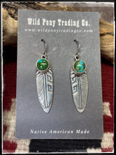 Load image into Gallery viewer, Sterling silver and Sonoran Gold turquoise feather earrings attributed to Ervin Hoskie. These are hallmarked and Navajo made. 
