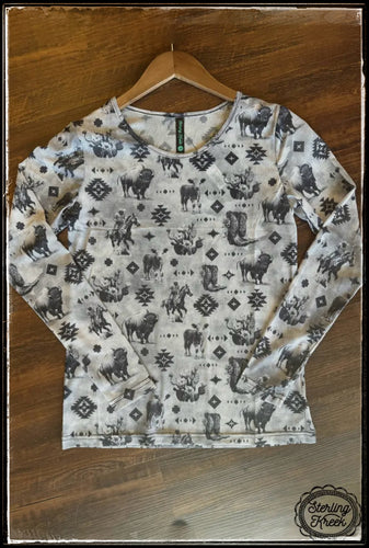 A sheer mesh top with long sleeves and a scoop neck. Features cowboys, buffalo, cattle, cactus, and aztec designs. From Sterling Creek   