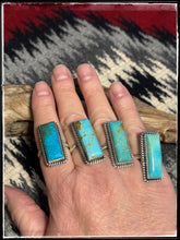 Load image into Gallery viewer, Kingman turquoise and sterling silver rings with an adjustable band from Navajo silversmith Alfred Martinez..
