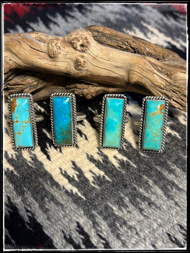 Kingman turquoise and sterling silver rings with an adjustable band from Navajo silversmith Alfred Martinez..