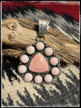 Load image into Gallery viewer, Pansy Johnson, Navajo silversmith., Pink conch cluster pendant set in sterling silver with an extra large bail.
