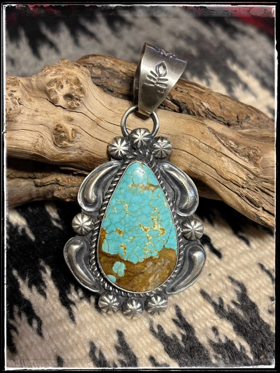 Sterling silver and turquoise tear drop pendant from Navajo silversmith Jeff James Jr.