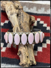 Load image into Gallery viewer, Pansy Johnson, Navajo silversmith.  Sterling silver and pink conch row cuff. 
